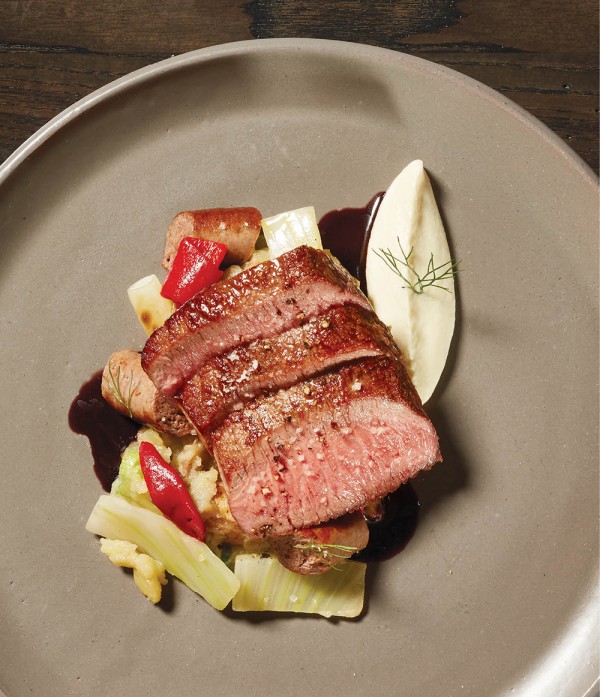 Cordero Al Ajillo: Lamb loin, pequillo peppers, fingerling potatoes, Merguez sausage, and fennel soubise