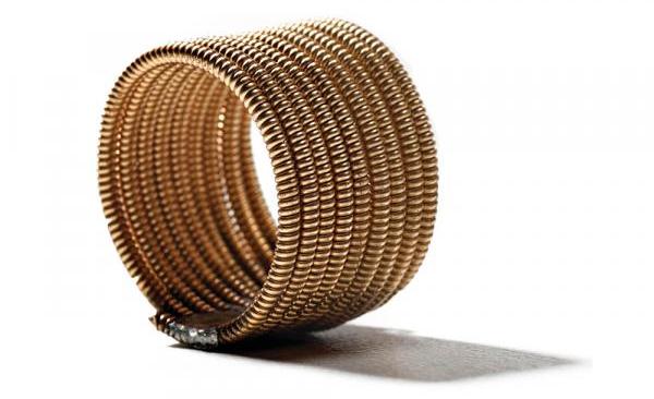 It takes major muscle to wrap guitar strings into coils, but the finished rings are worth it. $20 each