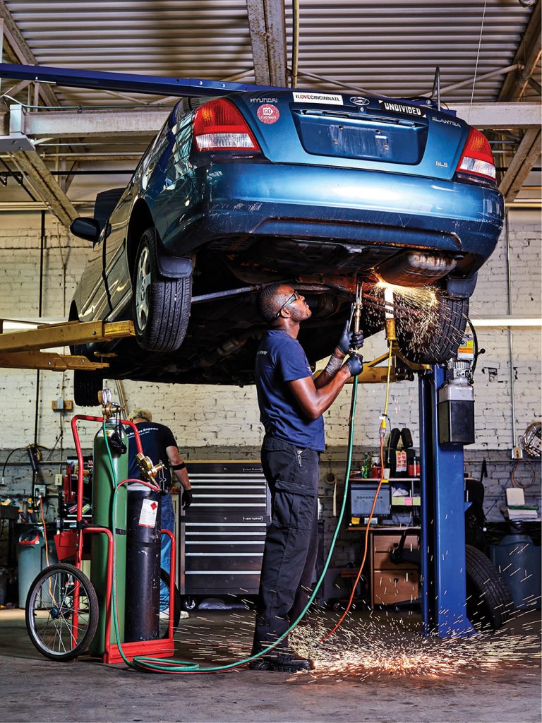 Eric Dallas teaches Changing Gears clients how to take care of their cars.
